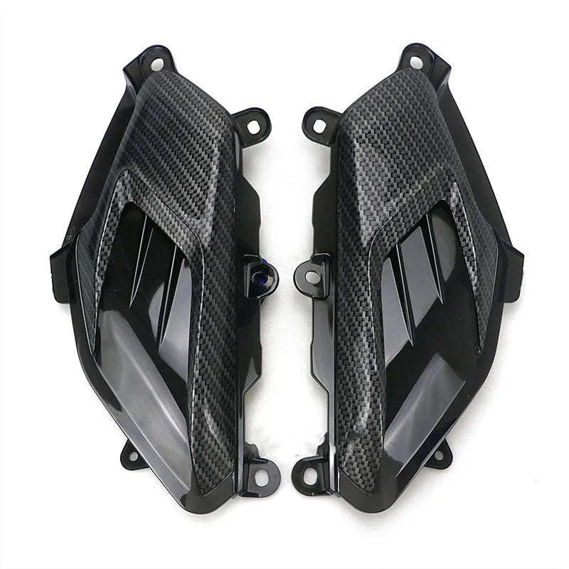 Pair of carbon fibre-style side lamp assemblies for Yamaha NMAX scooters with blue LED illumination option.