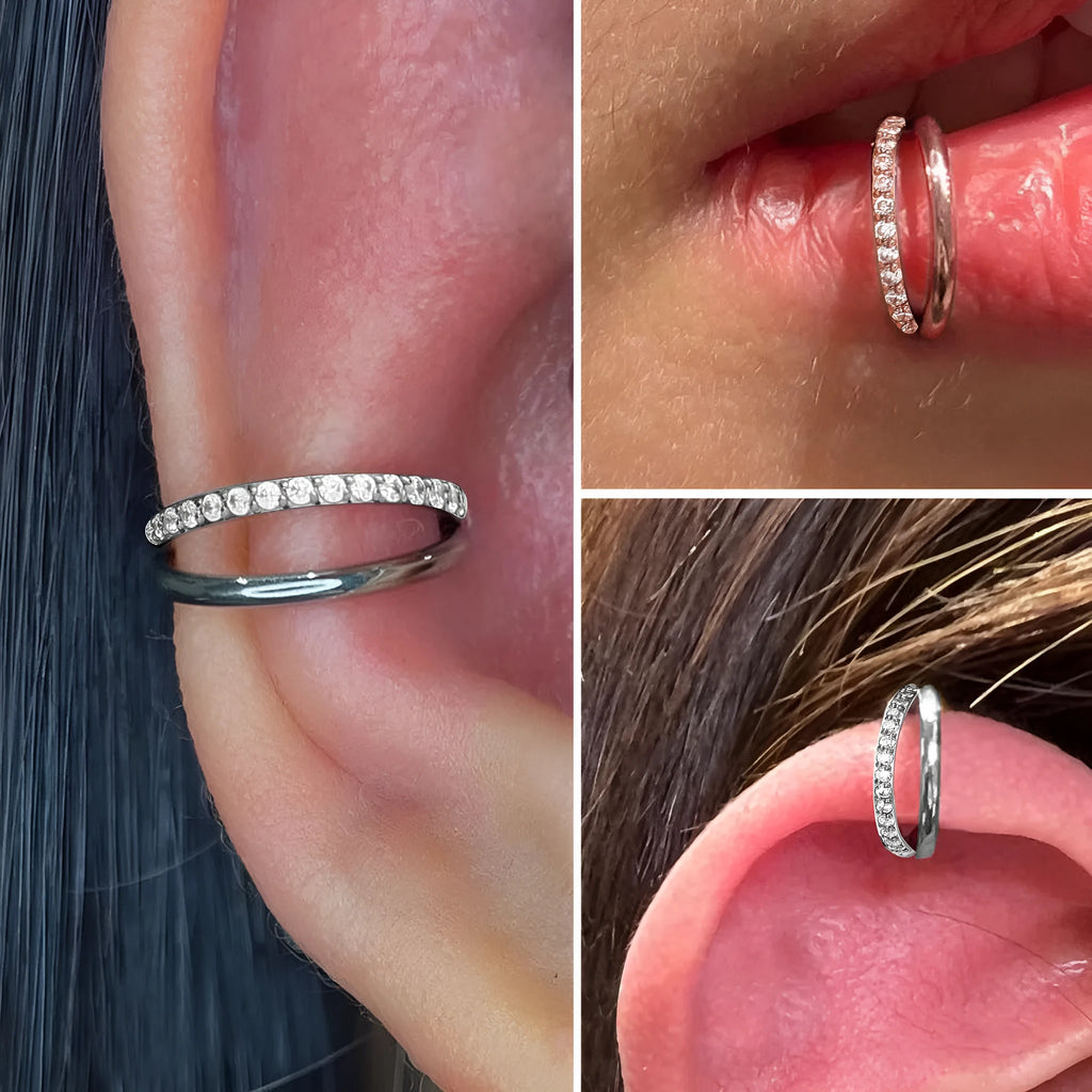Close-up of a titanium alloy fork nose ring in silver, showing the two-prong design on a grey background.