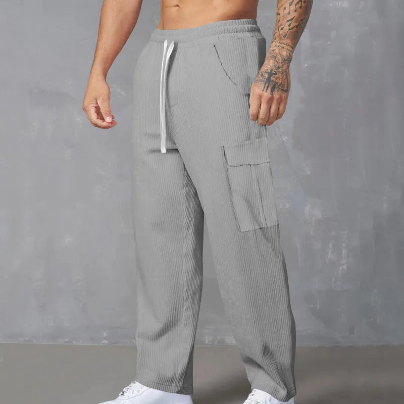 Men's corduroy cargo trousers in straight-leg wide-cut design with drawstring waist closure