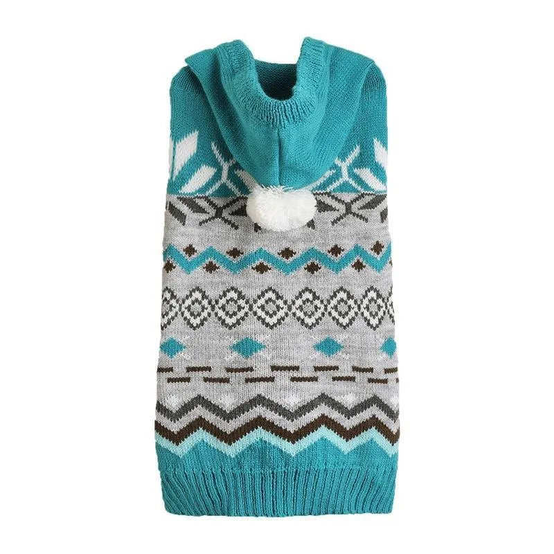 Green diamond pattern knitted acrylic sweater on a small dog, showing ribbed cuffs and classic knit design.