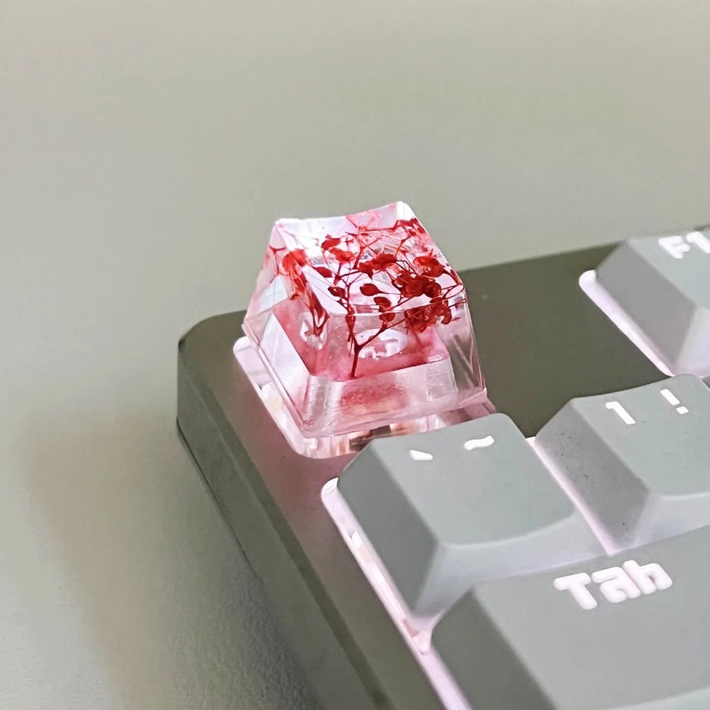 Single resin mechanical keyboard keycap with high transparency and embedded starry sky design, shown in violet colour.
