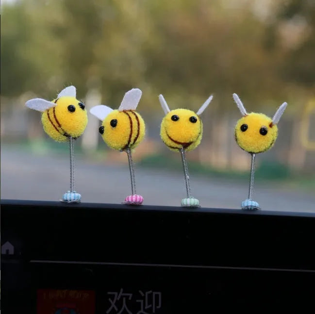 Cartoon bee car decoration ornament with furry ball material measuring 3x3cm