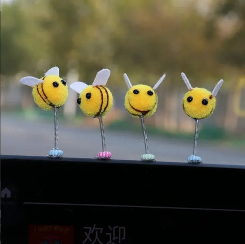 Cartoon bee car decoration ornament with furry ball material measuring 3x3cm