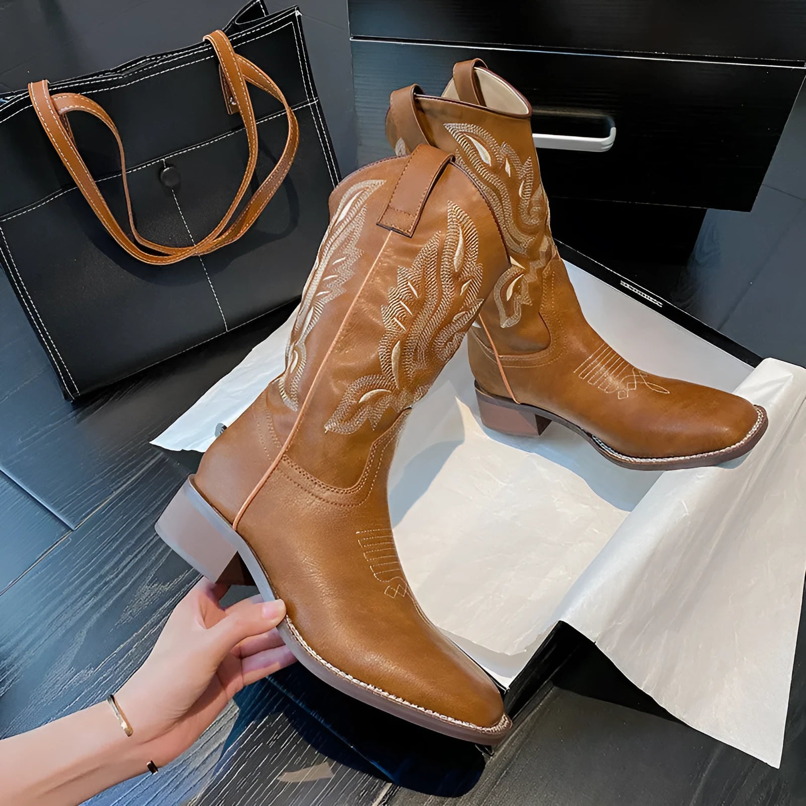 Brown women's embroidered mid-calf Martin boots with a round toe and low square heel.