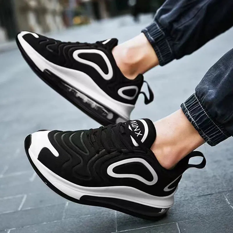 Men's black casual sneakers with lace-up front, thick sole, and round toe design