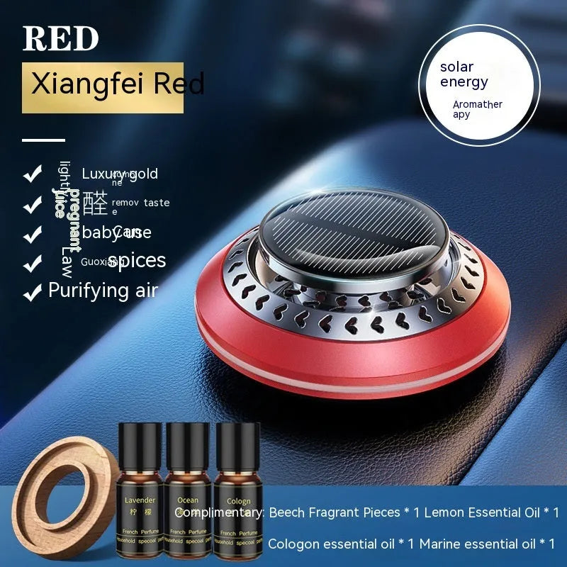 Solar-powered aluminium alloy car air freshener diffuser in black colour on a car dashboard.
