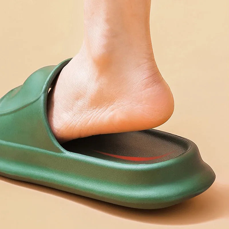 Thick-soled EVA flip-flop slippers in multiple colours on a bathroom floor, showing non-slip sole texture.