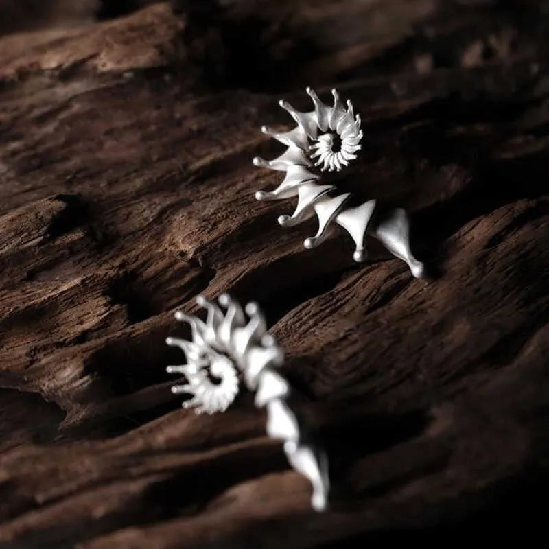 Exaggerated conch-shaped three-dimensional matte alloy stud earrings with electroplated finish