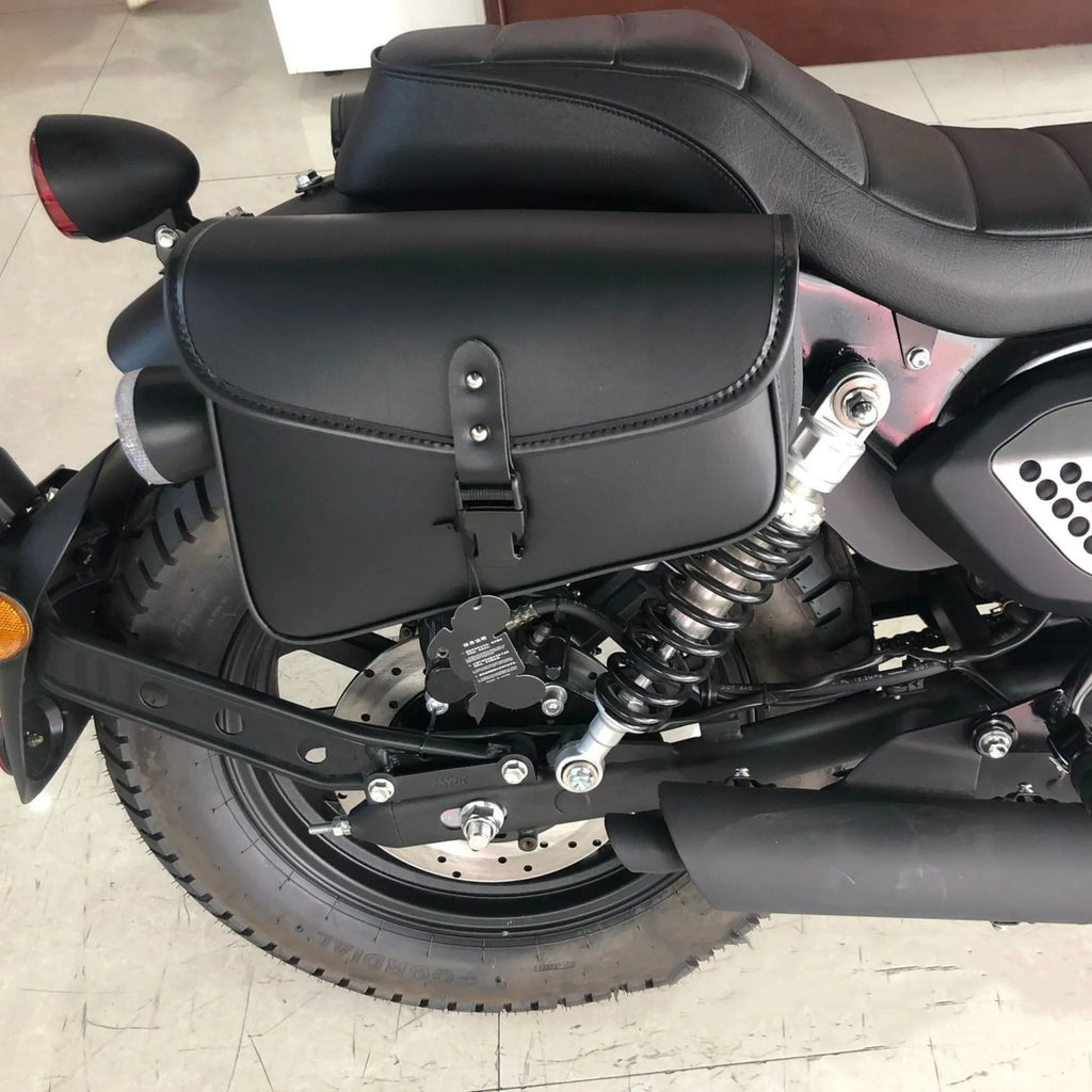 Black motorcycle swingarm saddlebag mounted on Harley-Davidson Sportster side