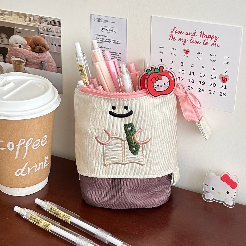 Brown Korean-style cartoon collapsible pencil case made from Oxford fabric, shown open.
