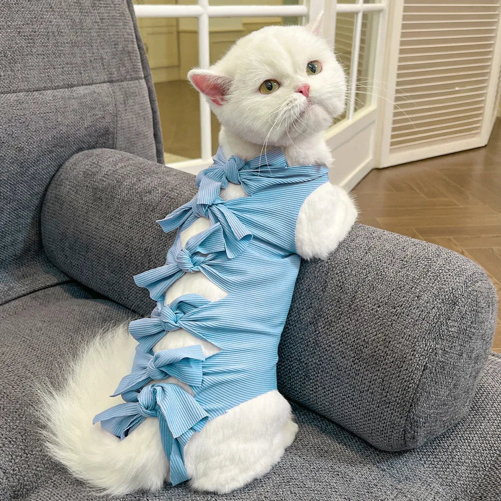 Lace-up polyester cat sterilisation recovery garment shown in blue, brown, green pineapple, pink, or purple