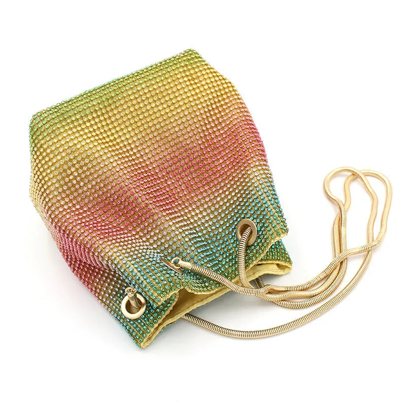 Small rainbow-coloured rhinestone bucket bag with a soft fabric construction.