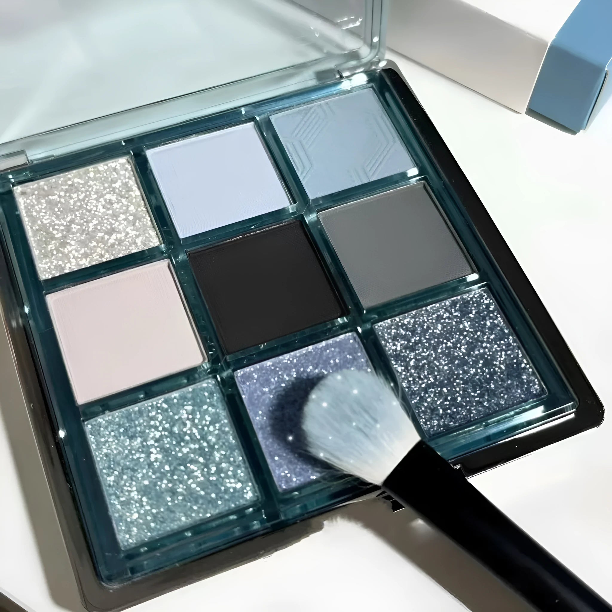 MUGELEEN nine-colour eye shadow palette 08 showing matte and shimmer shades including smoked blue.