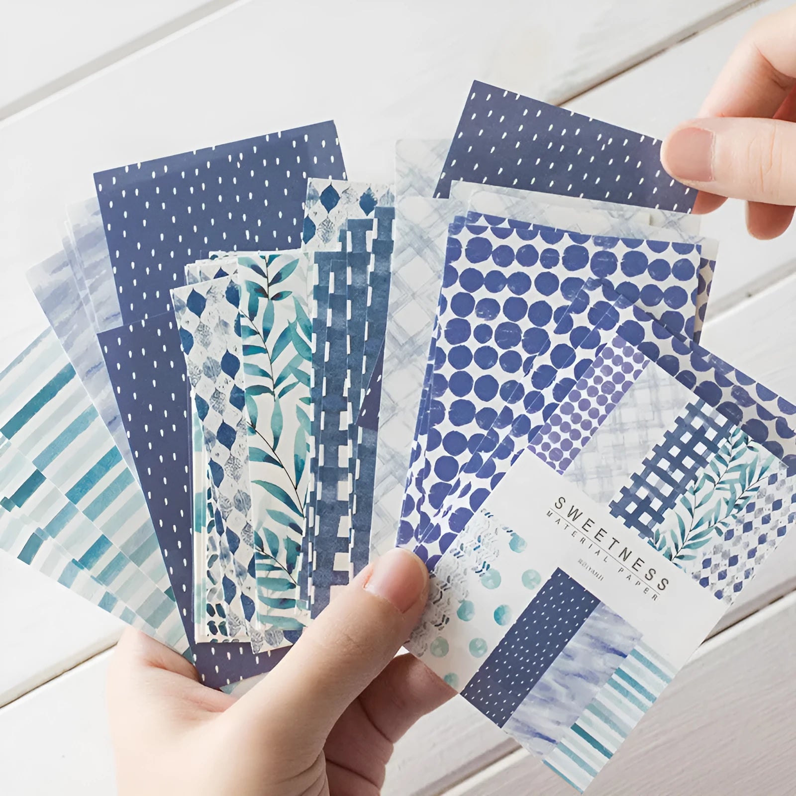 Retro collage note paper in ten pastel colours, each sheet 56mm by 83mm.