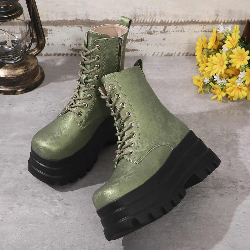 Women's black retro platform boots with patchwork design, chunky heel, and side zipper.