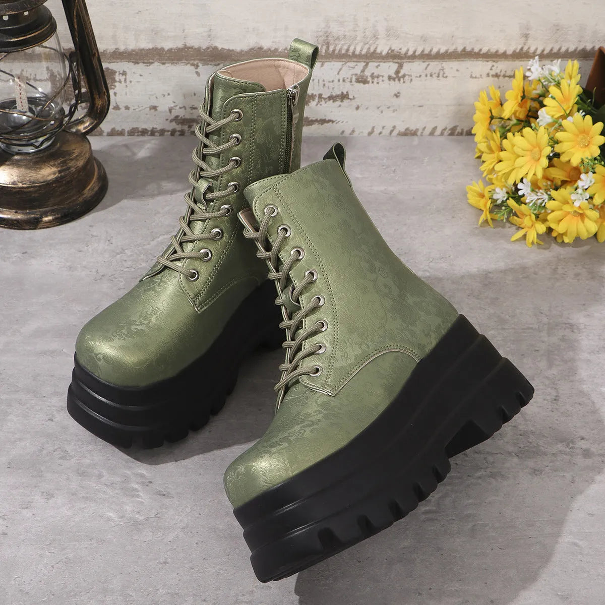 Women's black retro platform boots with patchwork design, chunky heel, and side zipper.