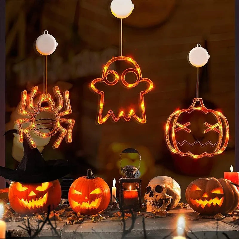Set of seven battery-powered Halloween LED hanging lights with ghost, spider, and pumpkin designs for window decoration.