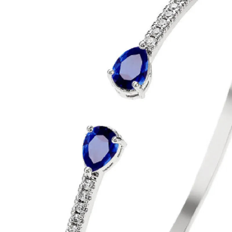 Copper personalised bracelet with multi-zircon inlaid design in simple style, shown in blue and white colour options.