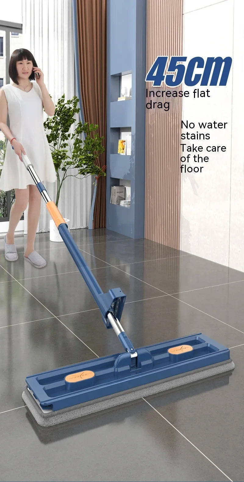 Large flat mop with long stainless steel handle and blue cleaning cloth on hard floor