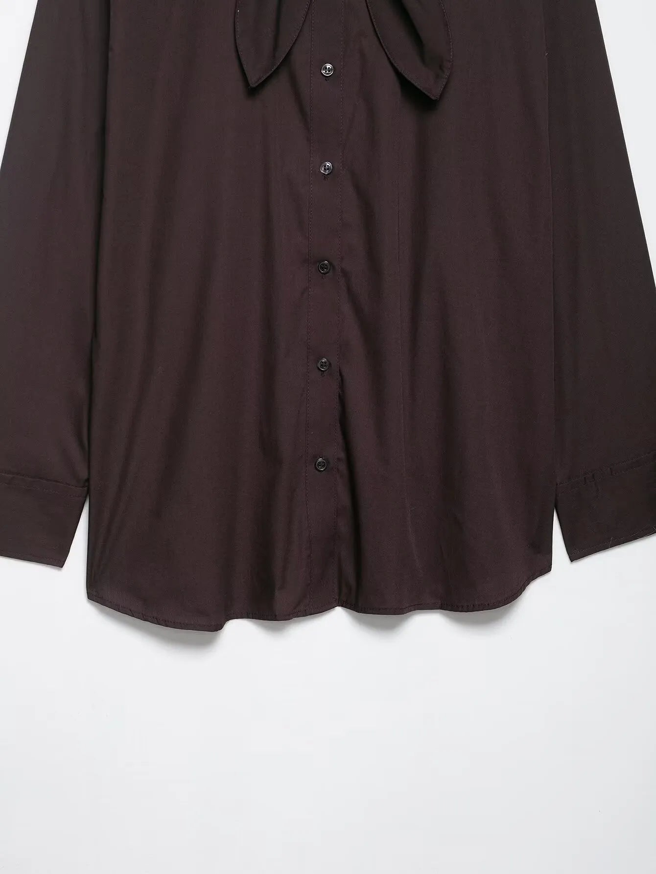 Brown women's poplin shirt with a bow tie, cardigan-style front, and long sleeves.