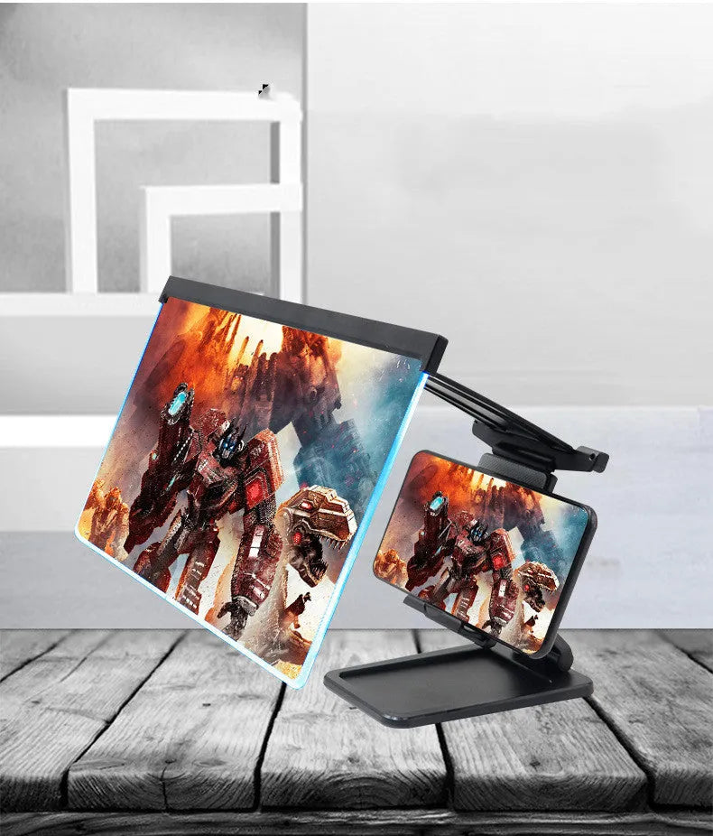 Black folding mobile phone screen magnifier with detachable holder on a desk