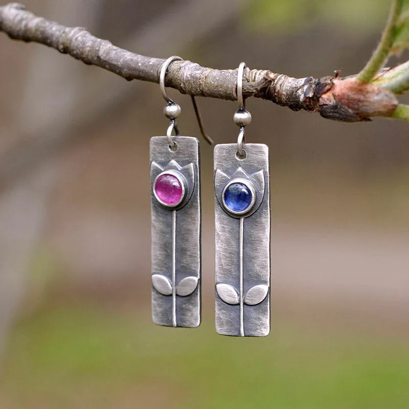 Antique finish red sapphire earrings with geometric ellipse shapes and electroplated metal construction