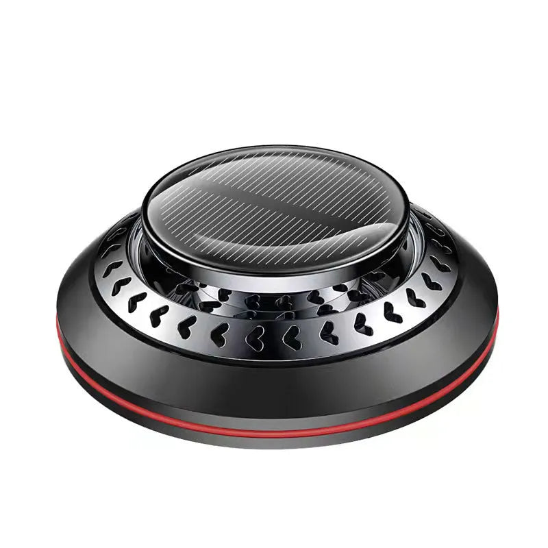 Solar-powered aluminium alloy car air freshener diffuser in black colour on a car dashboard.