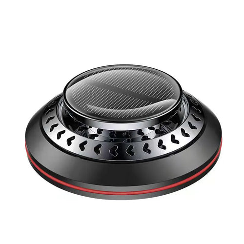 Solar-powered aluminium alloy car air freshener diffuser in black colour on a car dashboard.