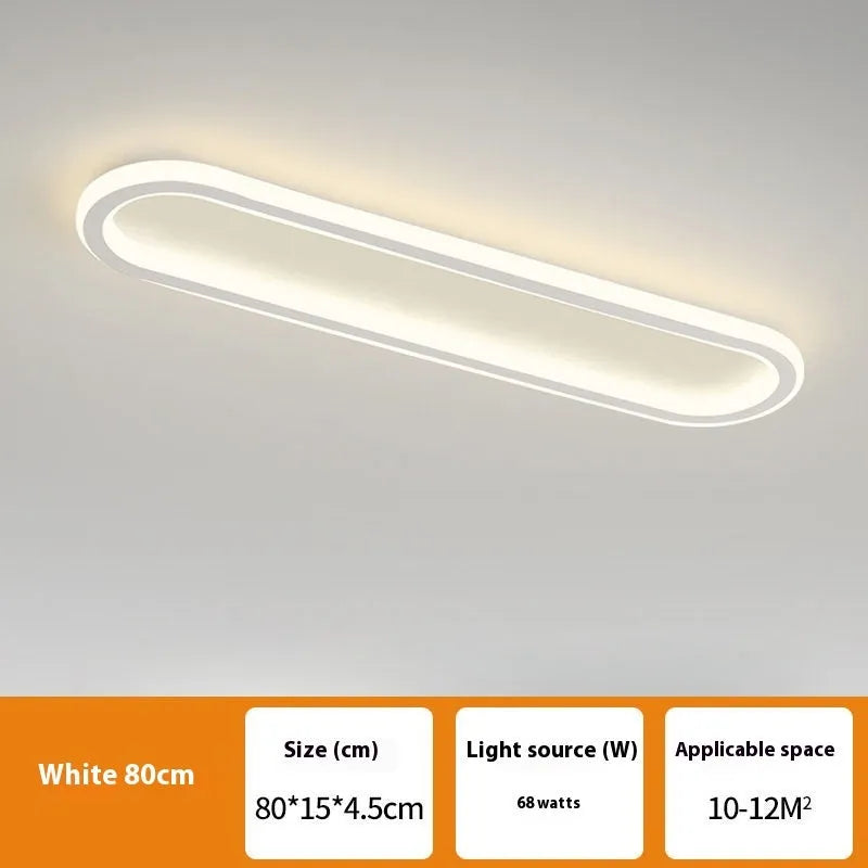 Black minimalist strip ceiling lamp mounted flush on a white ceiling.