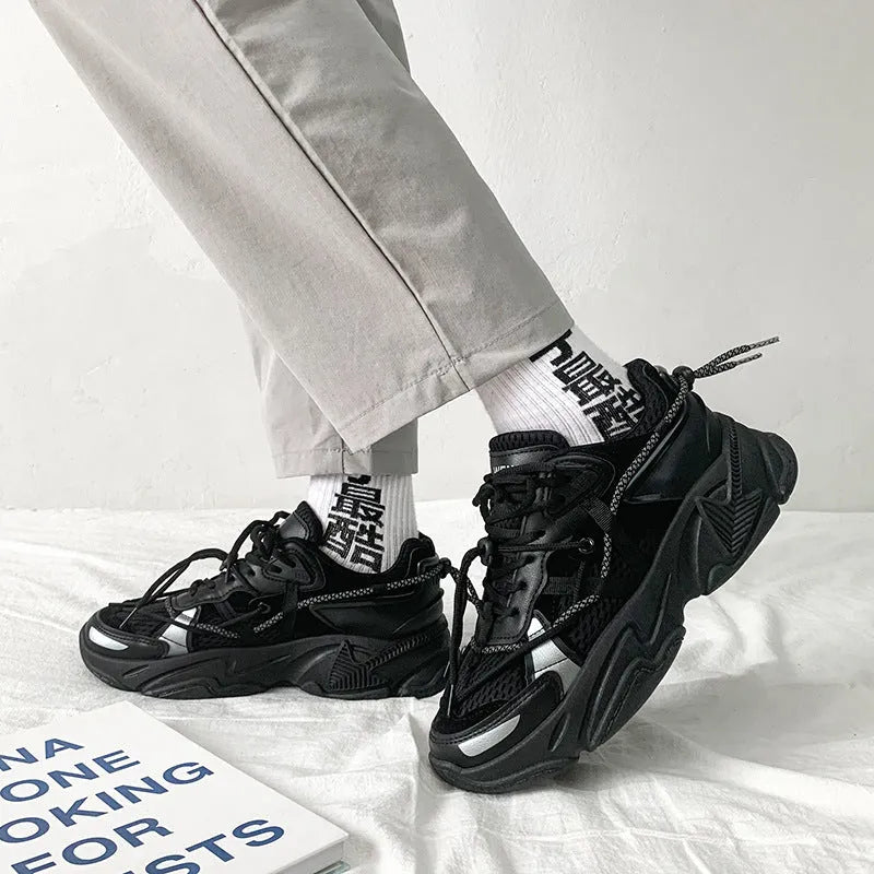 Men's white platform dad sneakers with a lace-up front and thick sole, shown on a grey background.