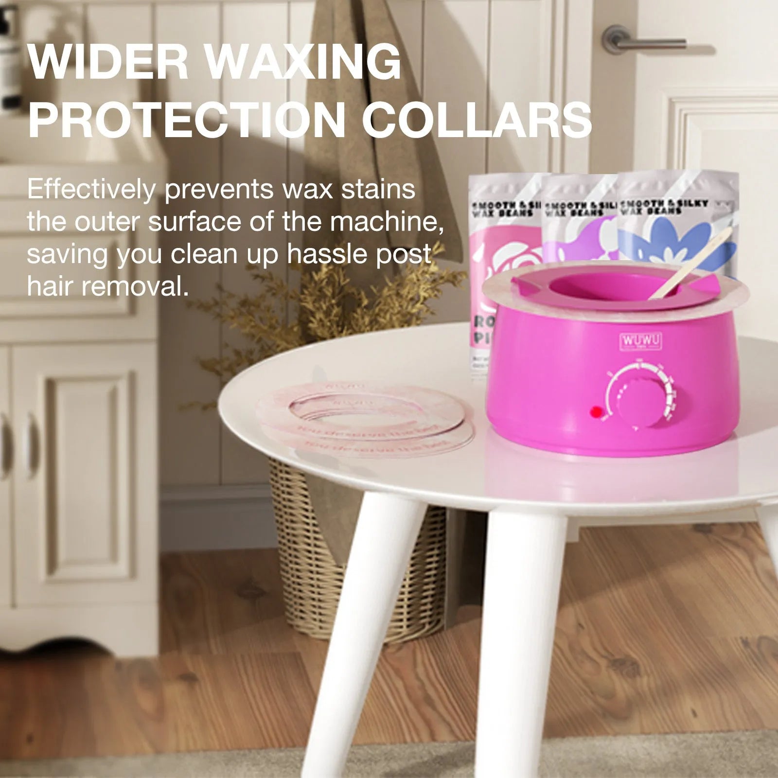 Professional waxing kit with black wax warmer, pots of hard wax beans, applicator sticks and post-care products on a pink background.