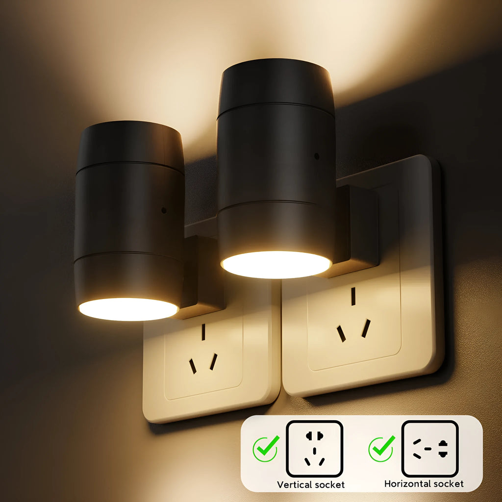 Small white induction night lamp plugged into a wall socket with a rotatable head.