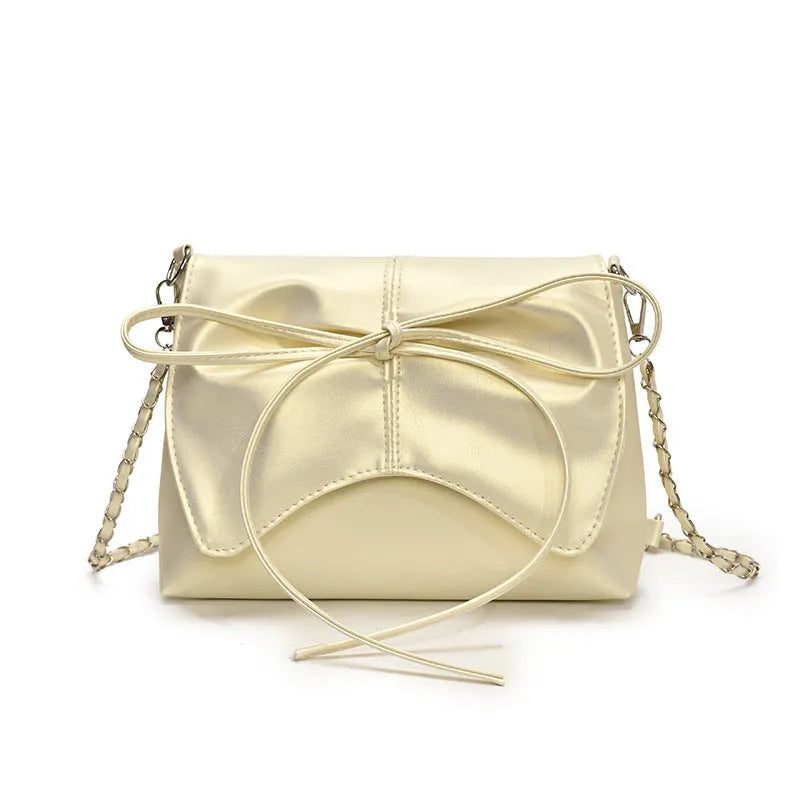 Women's underarm crossbody bag in horizontal square shape with sewing line details and phone pocket
