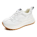 Women's beige cattlehide leather casual sports shoes with cross-strap design and lace-up closure
