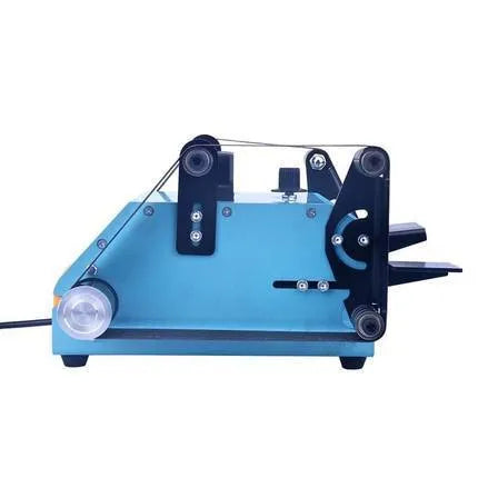 Blue desktop dual-axis belt sander for polishing and knife sharpening on a workbench.