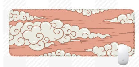 Large cloud pattern rubber desk mat with non-slip base on wooden desk surface