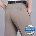 Man wearing black straight-leg high-waisted non-iron business trousers made from a Mulberry Silk blend fabric.