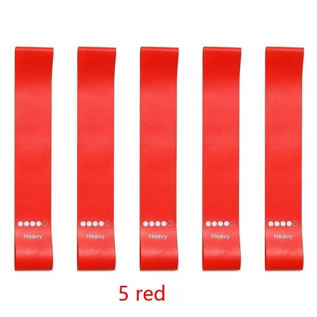 Five colour-coded TPE yoga tension straps with graduated thickness for resistance training