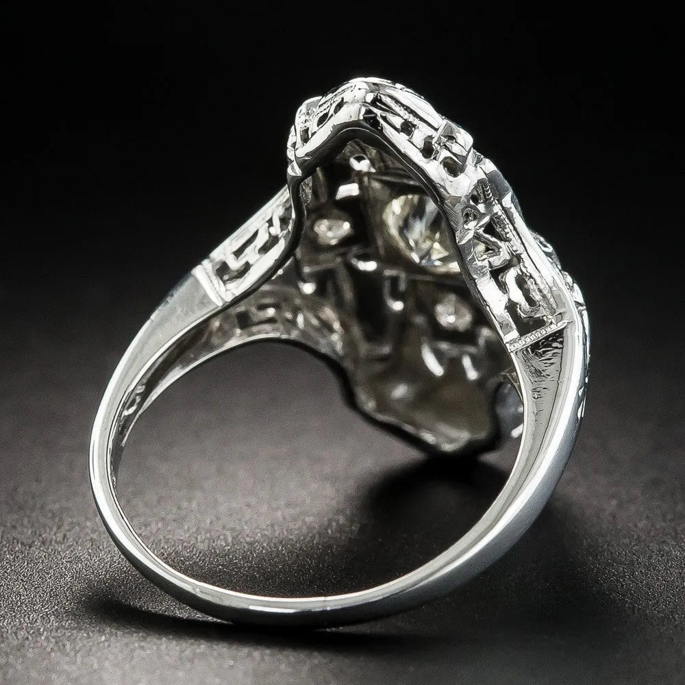 Geometric hollow out copper ring with silver electroplating and diamond stud accents on a grey background.