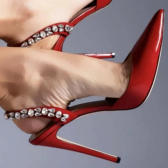 Women's pointed toe high heel sandals with rhinestone detail on patent leather upper.