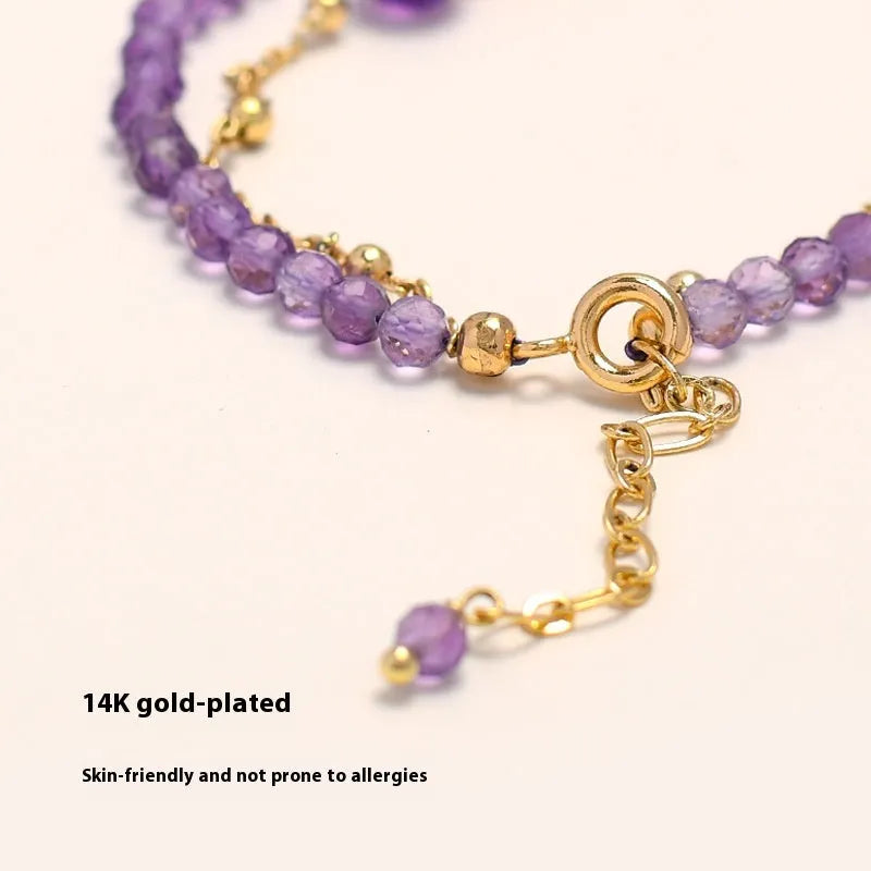 Chinese style women's bracelet with amethyst diamond-shaped crystals and electroplated finish.