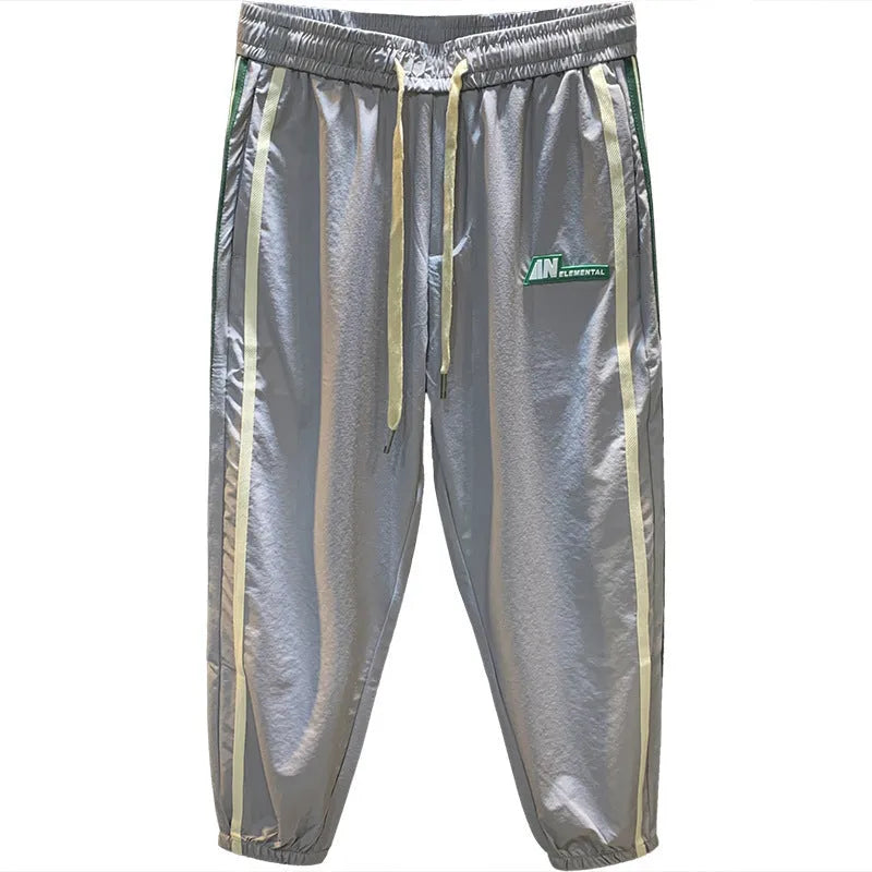 Men's black harem pants with mid-waist fit and trousers length made from ice silk cotton blend fabric