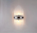 Modern petal-shaped crystal wall lamp with titanium finish in living room setting