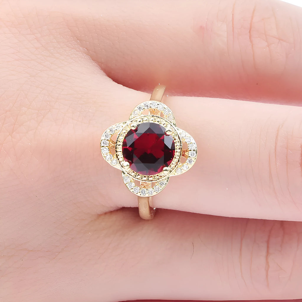 Copper fruit-shaped ring with zircon inlay in electroplated 10-6-1395 colour on a finger.