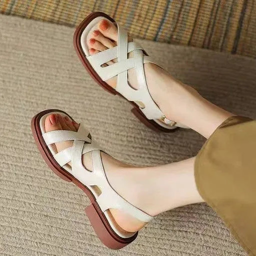 Women's patent leather square toe sandals with cross straps in black colour