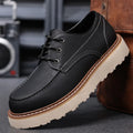 Men's black low-top Martin boots with round toe and non-slip rubber sole