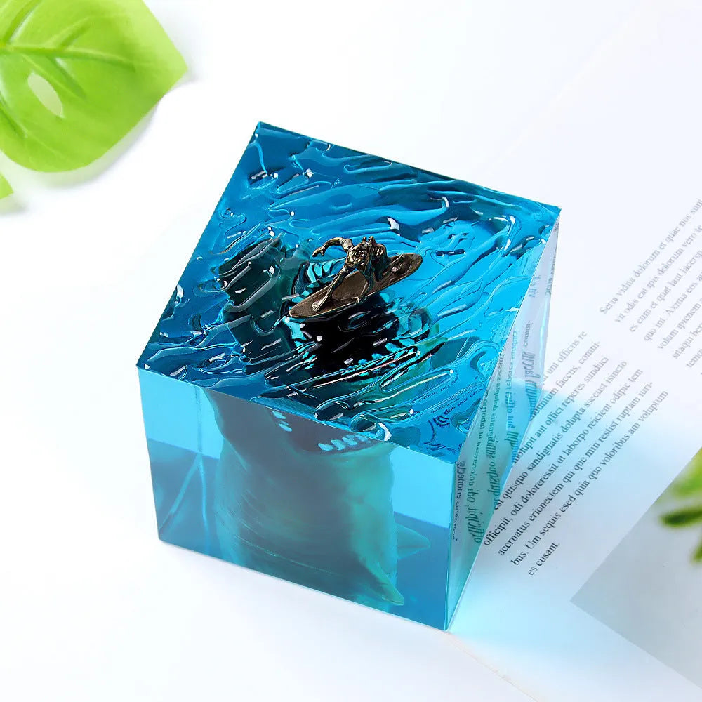 Epoxy resin shark surfer night light ornament on a desk, showing 5cm and 8cm size options.