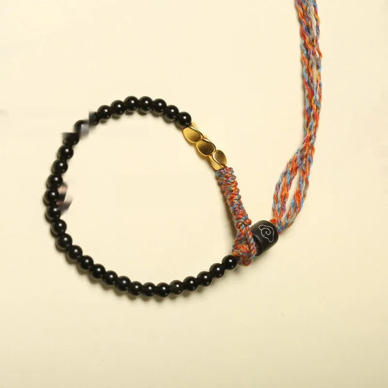 Hand-woven obsidian carrying strap showing texture and 4mm width