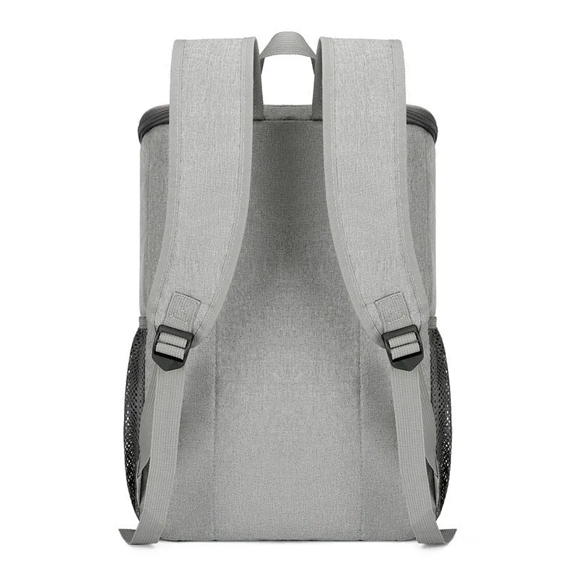 Large black outdoor backpack with curved shoulder straps showing expansion compartments for thermal picnic storage