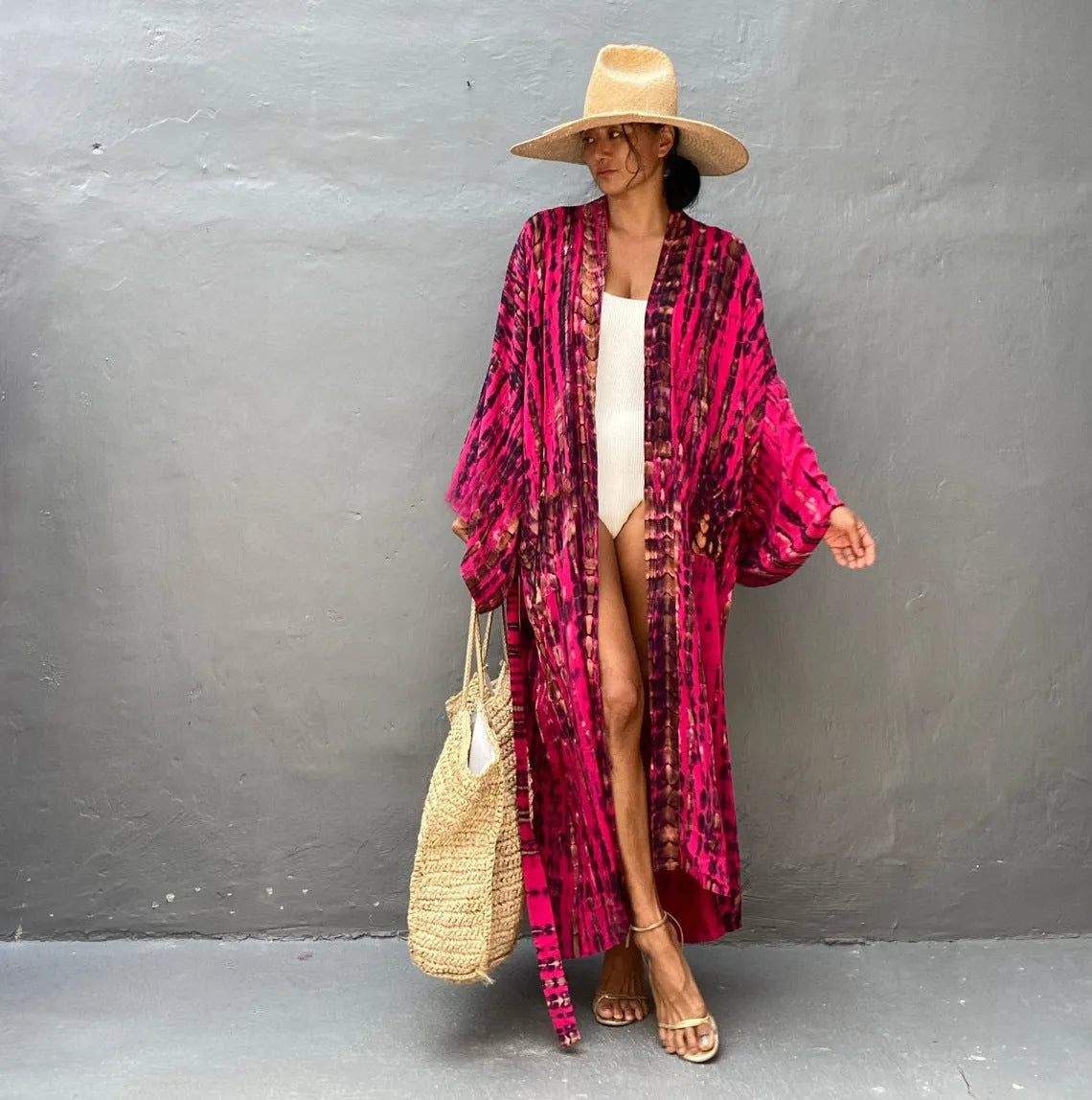 Loose-fitting cotton beach cover-up blouse in a printed pattern, shown in a rust red colour.